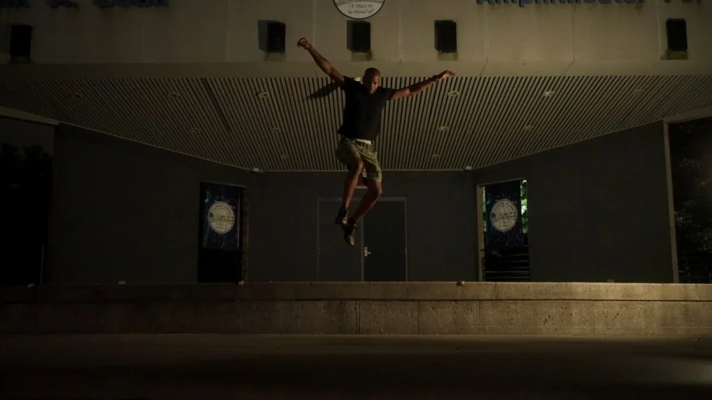 Dancer captured midair in a dramatic wide shot